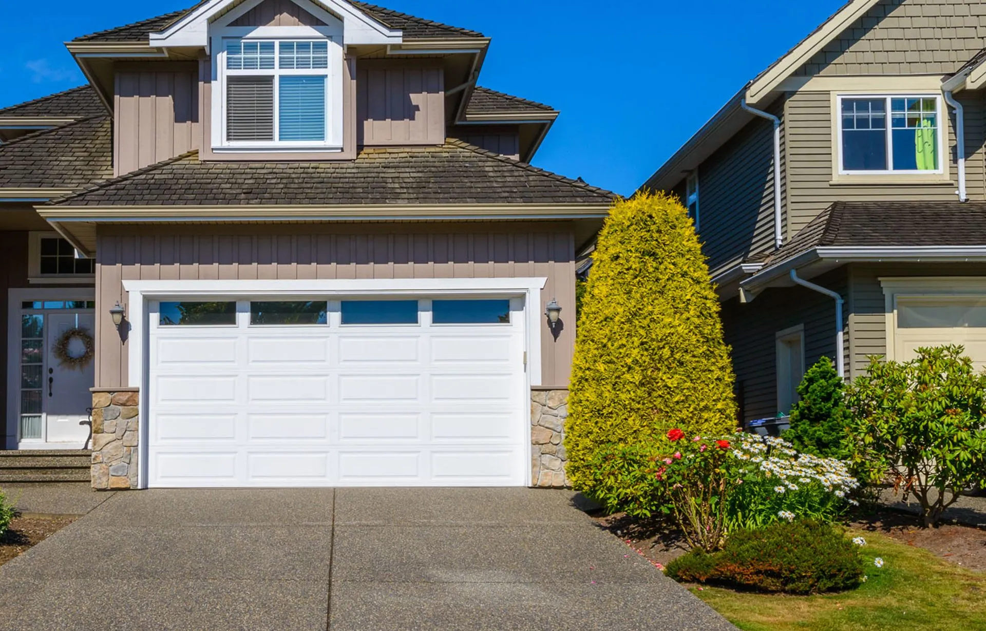 Two-car garage door on a suburban Tri-City home after a new door installation